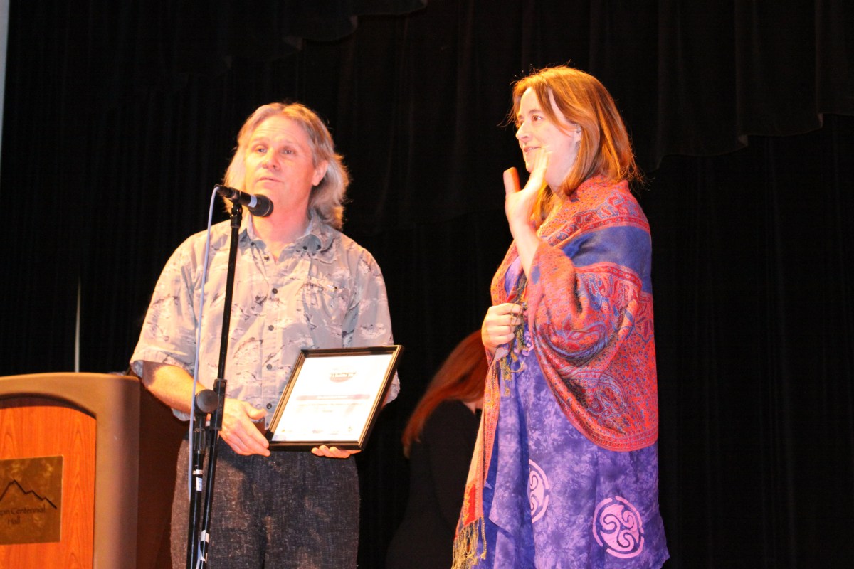 Sitka Local Foods Network president Kerry MacLane, left, and secretary/treasurer Linda Wilson say a few words after the Sitka Local Foods Network received a Community Wellness Champion award for nutrition at the 2009 Sitka Health Summit
