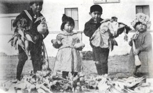 Children show off the bounty from the Klukwan School garden in 1911