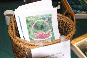 A basket of Florence Welsh's books for sale at Let's Grow Sitka!