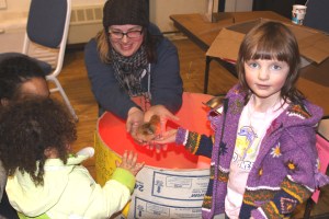 Lina and her mom hold one of several baby chicks owned by Andrew Thoms