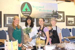 PHOTO COURTESY OF SITKA LOCAL FOODS NETWORK  Sitka Farmers Market representative and Sitka Conservation Society community sustainability organizer Tracy Gagnon, second from left, presents Sitka Spruce Catering owner Jeren Schmidt, third from left (with daughter Novah Lee Schmidt in backpack), with the table of the day award as Jeren's co-workers Tam Conatser, left, and Linda Bergdoll-Schmidt, right, watch. The table of the day award was for the second Sitka Farmers Market of the summer on Saturday, July 30, 2011, at the Alaska Native Brotherhood Hall in Sitka, Alaska. Sitka Spruce Catering uses locally grown veggies, herbs and other local products to create the food it provides through its catering operation. Jeren, Tam and Linda received a tote bag full of bread, veggies and other prizes from the market. The next Sitka Farmers Market is from 10 a.m. to 2 p.m. on Saturday, Aug. 13, 2011, at ANB Hall. To learn more about the Sitka Farmers Market and other Sitka Local Foods Network projects, go to http://www.sitkalocalfoodsnetwork.org/.