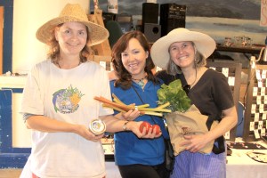 PHOTO COURTESY OF SITKA LOCAL FOODS NETWORK  Sitka Local Foods Network board members Cathy Lieser, left, and Lisa Sadleir-Hart, right, present jewelry maker Kiki Norman of Art Glass By Kiki with the Table of the Day Award from the third Sitka Farmers Market of the season on Saturday, Aug. 13, 2011, at the Alaska Native Brotherhood Hall. The prize included fresh produce, preserves and a set of Alaska Grown tote bags. The next Sitka Farmers Market is from 10 a.m. to 2 p.m. on Saturday, Aug. 27, at ANB Hall (235 Katlian St.).