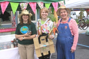 PHOTO COURTESY OF SITKA LOCAL FOODS NETWORK  Sitka Local Foods Network board vice president Linda Wilson, left, and former SLFN board member Lynnda Strong, right, present Amanda Hershberg, owner of The Cupcake Bar by Twinflower Sugar Craft, with the Table of the Day Award from the fourth Sitka Farmers Market of the season on Saturday, Aug. 27, 2011, at the Alaska Native Brotherhood Hall. The prize included fresh produce, preserves and a set of Alaska Grown tote bags. The fifth and final Sitka Farmers Market of the season is from 10 a.m. to 2 p.m. on Saturday, Sept. 10, at ANB Hall (235 Katlian St.). There will be a smaller market held as part of the annual Running of the Boots fundraiser for the Sitka Local Foods Network on Sept. 24 at the Crescent Harbor Shelter.