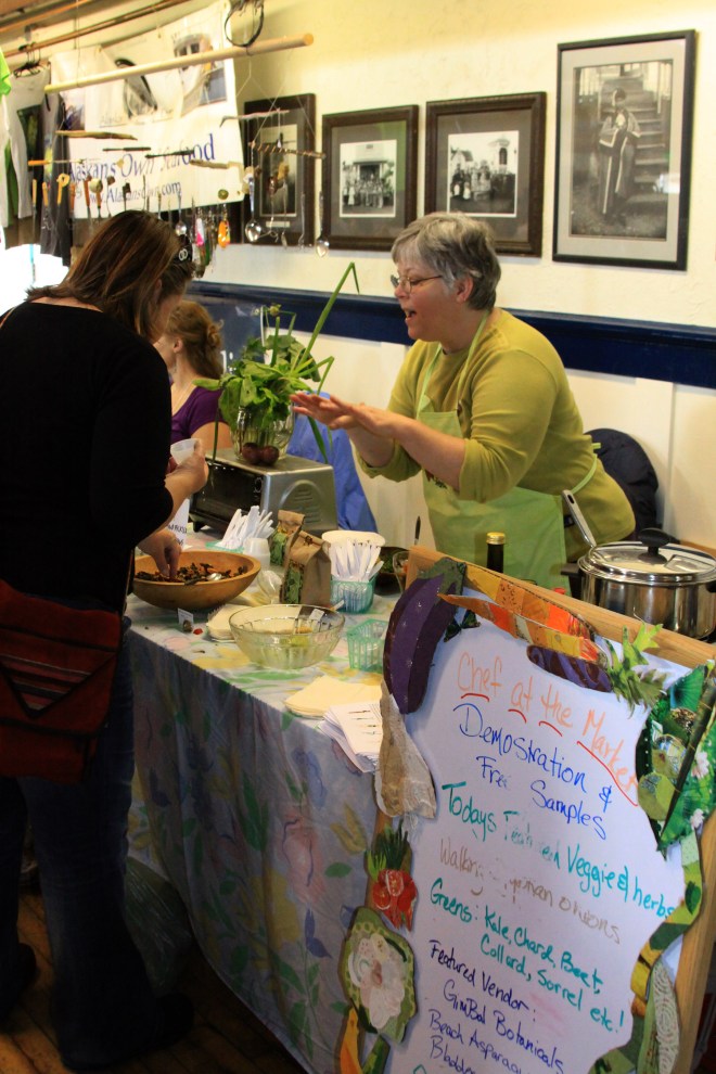 Suzan Brawnlyn, the Chef at the Market, discusses how to cook Egyptian walking onions during a cooking demonstration on Aug. 18, 2012, at the fourth Sitka Farmers Market of the season.