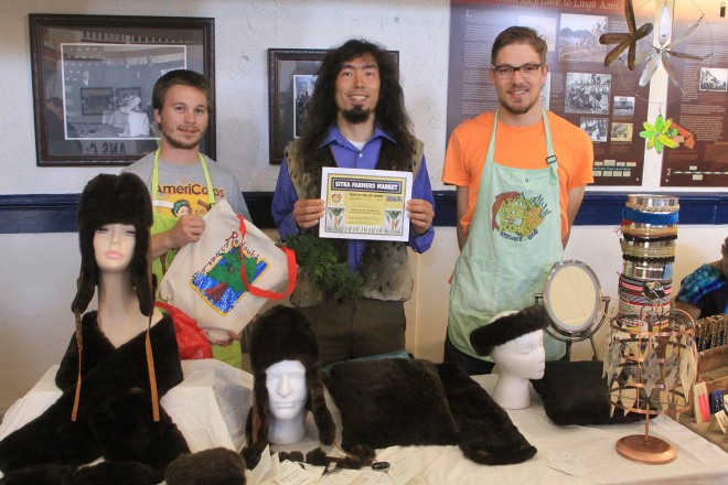 PHOTO COURTESY OF SITKA LOCAL FOODS NETWORK Sitka Farmers Market Interim Manager Garrett Bauer, left, and Co-Manager Francis Wegman-Lawless, right, present the Table Of The Day Award to to Peter Williams of Ata "Let Me See" Alaska (http://www.seaotterfur.com/) during the sixth and final Sitka Farmers Market of the season on Saturday, Aug. 31, at the Alaska Native Brotherhood Founders Hall in Sitka. Peter is a Yup'ik  (Ata is Yup'ik for let me see) who sells handmade garments made sea otter fur, the softest and densest fur on earth. Peter has been selling at the Sitka Farmers Markets for a couple of years. He received a gift bag with fresh produce, fand a certificate and a copy of the Alaska Farmers Market Cookbook. This is the sixth year of Sitka Farmers Markets, hosted by the Sitka Local Foods Network. For more information about the Sitka Farmers Markets and Sitka Local Foods Network, go to http://www.sitkalocalfoodsnetwork.org/ or https://www.facebook.com/SitkaLocalFoodsNetwork. Also, don't forget the Sitka Local Foods Network will host the annual Running of the Boots costumed fun run at 11 a.m. on Saturday, Sept. 28 (registration at 10 a.m. and costume contest at 10:30 a.m.), with the start/finish line near St. Michael's Russian Orthodox Cathedral in downtown Sitka. The Running of the Boots is a fundraiser for the Sitka Local Foods Network. Some late-season vegetables and other items will be for sale at this event. Finally, don't forget to vote for the Sitka Local Foods Network in the 50 States for Good contest. We are Alaska's only finalist in the national contest, where 51 nonprofit organization finalists (one from each state and the District of Columbia) have a chance to win $10,000 from Tom's of Maine, which will award grants of $10,000 each to the top 15 vote-getters in an online vote. You can vote for us once each day through Oct. 15 by going to http://www.50statesforgood.com/ and following the instructions. We appreciate your support.