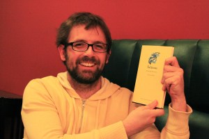 NicolaasMinkWithBookOnSalmon