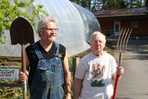 Former Sitka Local Foods Network President Kerry MacLane, left, and Sprucecot Gardens Owner Judy Johnstone pose in front of one of the high tunnels recently erected on Judy’s land on Peterson Street. (Photo Courtesy of KCAW-Raven Radio)