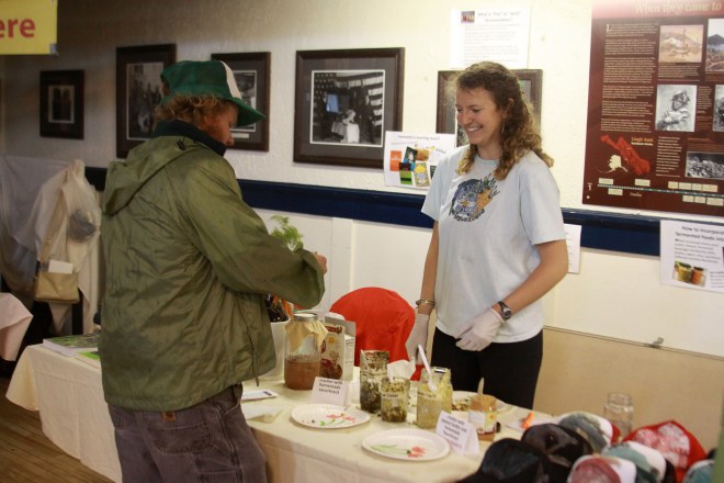 McLane Ritzel, the Sitka Local Foods Network's 2014 summer Bulldogs on Baranof intern, hosts a fermentation demonstration during the Sitka Farmers Market.