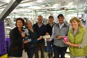 Sitka Sound Science Center Director Lisa Busch, left, and the center’s board of directors receive a $75,000 check from Silver Bay Seafoods CEO Rich Riggs and plant manager Wayne Unger recently at SBS’s new canning facility. From left are Busch, Linda Waller, Steve Clayton, Unger, Riggs, and Trish White. (Daily Sitka Sentinel Photo by James Poulson)
