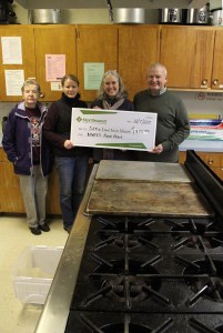 From left, Dorrie Farrell and Kristy Miller of the Sitka Kitch community rental commercial kitchen advisory team and Sitka Local Foods Network president Lisa Sadleir-Hart receive a check for $1,975 from Michael Wittman of Northwest Farm Credit Services to support a Sitka Kitch project to teach basic culinary skills to people wanting to get jobs in the food/restaurant industry. The classes will take place in March.