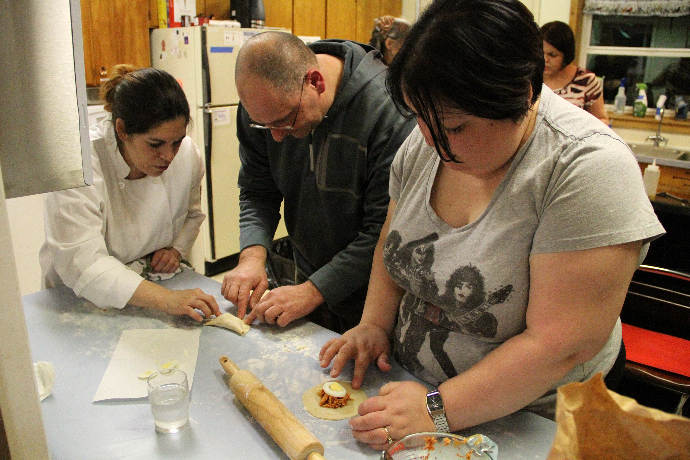 BarbaraHelpsMikeAndKendraFoldSalmonEmpanadas